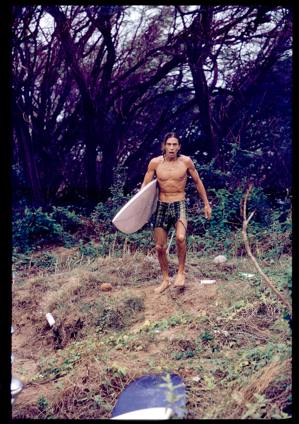 Heading out to surf, '70s
